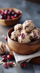 Delicious no-bake oatmeal cranberry energy bites in wooden bowl on rustic table