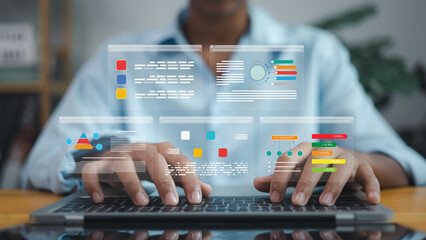 Businessman analyzing data with futuristic digital interface for analytics and technology concept