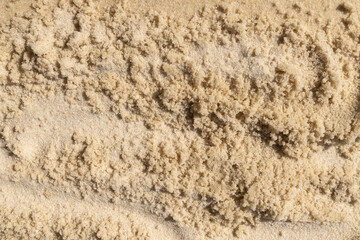 Fine beach sand with textured surface and natural patterns