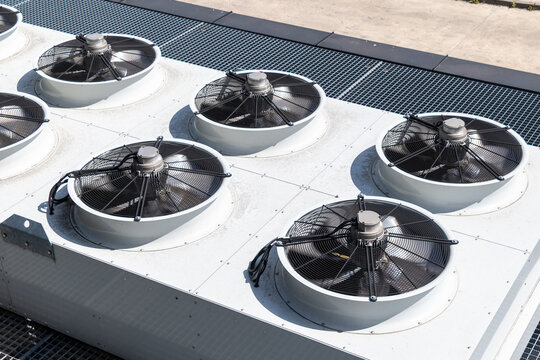 Industrial hvac system with large cooling fans on rooftop unit