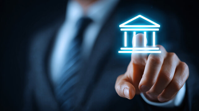 A person in a suit pointing to a digital bank icon. This symbolizes modern banking, financial technology, & the changing landscape of finance.
