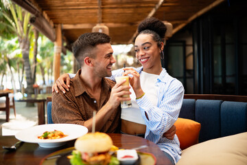 Happy couple enjoying quality time together, sharing laughter, love, and enjoying food together