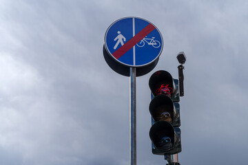 Traffic lights switched to red for bicycles. Stop pedestrian and cyclist shared route sign