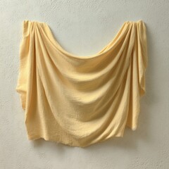 Soft, pale yellow fabric draped, studio shot, smooth texture, elegant display.