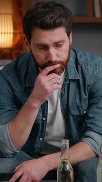 Caucasian middle-aged frustrated disappointed man at home party canceled with pizza chips stress alone lonely male guy on couch suffering without no friends birthday loneliness isolation quarantine