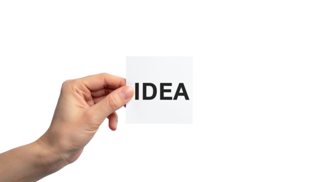 Hand holding a card with the word Idea, symbolizing a creative spark. The hand grasps a white card with bold black text, symbolizing inspiration and insight. The image evokes concept of creativity. 