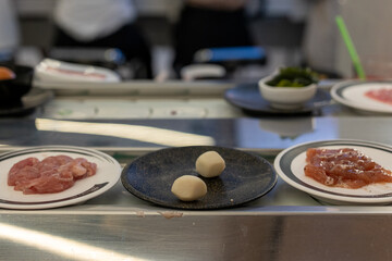 Fish Balls on Plate at Shabu-Shabu Conveyor Belt Restaurant