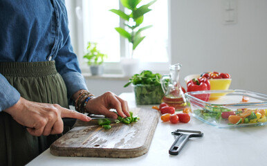 Woman Slicing Green Pepper