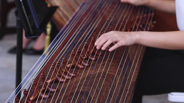 Traditional Korean folk musical instrument Gayageum, female orchestra band performing concert on Kayagum in of Seoul, South Korea, wooden zither with 12 strings, Koto or Guzheng live music performance