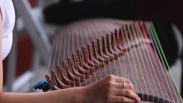 Traditional Korean folk musical instrument Gayageum, female orchestra band performing concert on Kayagum in of Seoul, South Korea, wooden zither with 12 strings, Koto or Guzheng live music performance