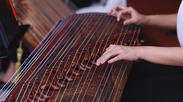 Traditional Korean folk musical instrument Gayageum, female orchestra band performing concert on Kayagum in of Seoul, South Korea, wooden zither with 12 strings, Koto or Guzheng live music performance