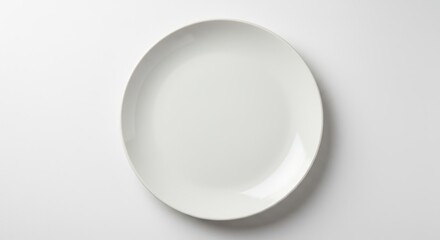 Clean, empty, ceramic dinner plate centered and isolated on a seamless pure white background, featuring high key lighting and copy space ,cooking ,seamless ,white