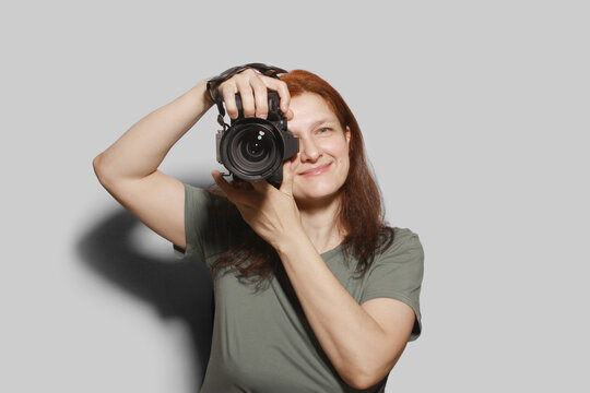 Woman with DSLR Camera