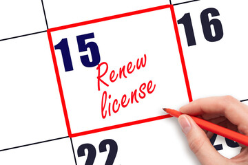 15 th day of the month.  Hand writing Renew license reminder and drawing red frame on calendar with red pen on white background. Business concept. Planning and scheduling