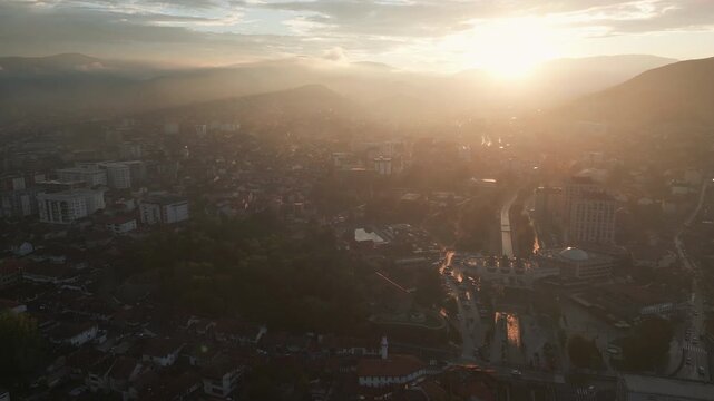 Picturesque aerial footage unveils a panoramic view of Novi Pazar, Serbia at sunset