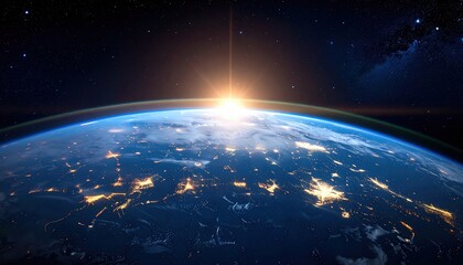 Obraz premium A breathtaking view of Earth from space, highlighting a sunrise over the horizon and twinkling city lights at night.
