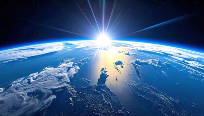 Fototapeta premium A stunning view of Earth from space, showcasing the curvature of the planet, clouds, and sunlight breaking over the horizon.