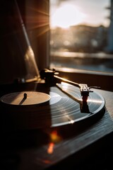 Obraz premium Sunset melodies on a vinyl record create a warm, nostalgic atmosphere