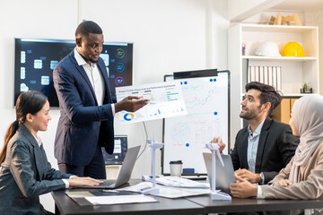 businessman colleague discuss explain budget performance planning, sharing idea for cost reduction, business black people man diverse employee coworker in formal suit meeting in finance office
