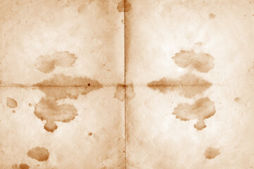 Stained Old Paper Texture Background. Old vintage paper folded in four. Brown crumpled and folded parchment vintage paper sheet with space for text