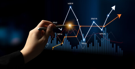 A hand holding a pen highlights stock market analysis, showcasing a digital display of graphs and candlestick charts against a dark background. Scalp