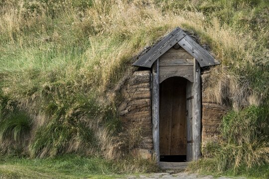 Traditional turf house with wooden door and grass sod roof, replica of a Viking longhouse, home of Eir&iacute;kr &THORN;orvaldsson or Erik the Red, Eir&iacute;kssta&eth;ir, Iceland