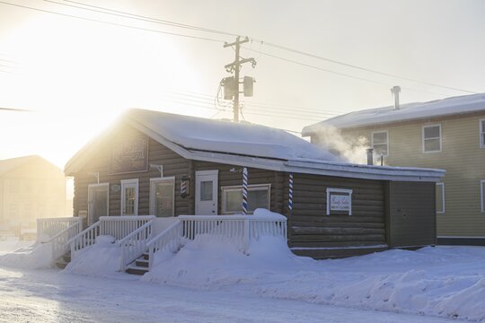 Historic building, fog, ice fog, snow, winter, cold, sun, smoke, Dawson City, Yukon, Canada