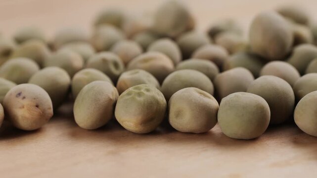 Dry seeds of peas for home vegetable garden etc. Assorted mix of varieties hence variation. Isolated on white background.