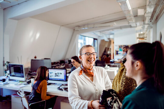 Designer working in textile design office - Powered by Adobe