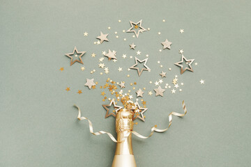 Party, New Year or birthday festive background with golden champagne bottle and confetti stars....