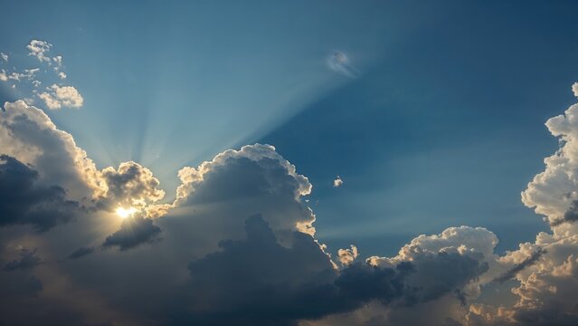 Post-thunderstorm clouds with sunlight breaking through and rays of light. Weather and sky scene. Atmosphere and weather conditions. The scene of clouds after a storm