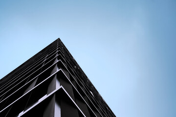 Detailed close-up of a modern architectural facade showing repeating geometric panels, clean symmetry, and refined minimalist design.