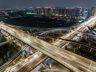 Naklejka premium Aerial views of urban highways and interchanges at sunrise