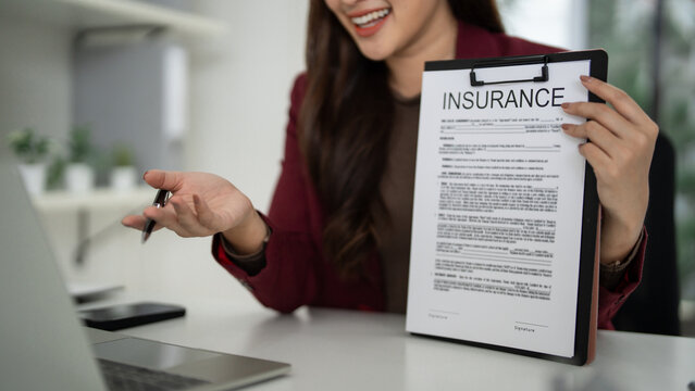 Asian adult businesswoman presenting insurance policy document professional sales agent expert consultation advice for home property investment