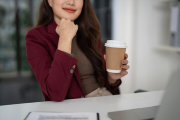 Adult Asian businesswoman real estate agent client consultation office professional successful property sales planning confident financial advisor coffee break for growth