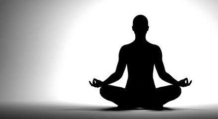 Silhouette meditating in lotus pose achieving inner peace and calm