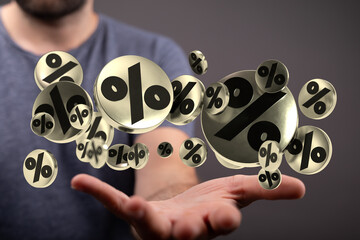 A person holding up many golden percentage symbol illustrations representing financial concepts...