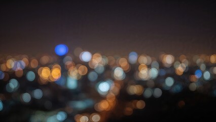 Blurred abstract bokeh background of city lights at night.