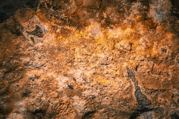 detail of a granite stone with coppery tones