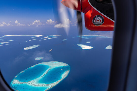 Best Fantastic Maldives Aerial Landscape Seaplane Window View Atolls Coral Reefs Island Blue Ocean Lagoon Background. Top Amazing Nature Tourism Scenic Destination Travel. Maldives, Ari Atoll 04.17.25