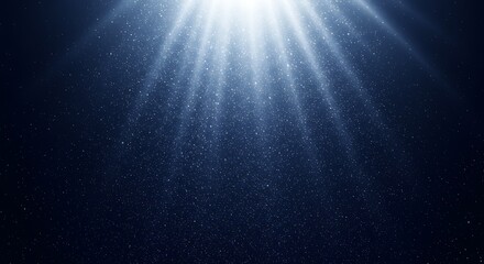 Fototapeta premium Abstract dark blue background with bright light rays and floating particles