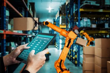 Smart robot arm systems for innovative warehouse and factory digital technology . Automation manufacturing robot controlled by industry engineering using IOT software connected to internet network .