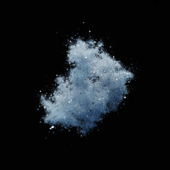 Abstract cloud of blue powder exploding against a black background