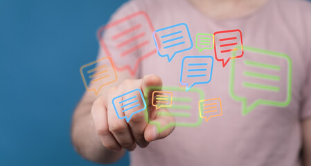 Person pointing to digital message bubbles, symbolizing online communication, social media interactions, and networking. Represents connection,