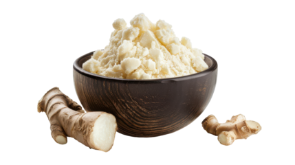Freshly grated ginger root in a wooden bowl showcasing its texture and freshness, isolated on white background