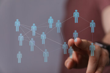 Visualize connection and teamwork in the digital world. Human figures networked together representing connection, community and global teamwork