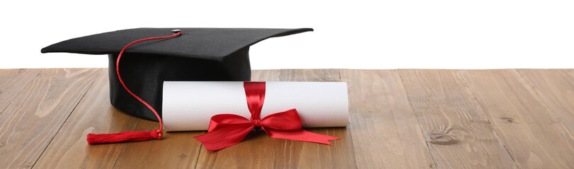 Graduation cap and diploma on wooden table against white background