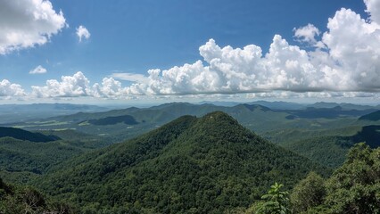  stunning panoramic view of majestic mountains, showcases the breathtaking beauty and natural grandeur. background,sky,summer,travel,nature,landscape,forest,mountain,green,blue