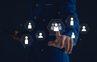 business professional selecting a virtual team icon on a digital interface. Concept of human resource management, recruitment, leadership, teamwork, and digital business networking.