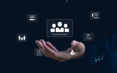 Employee benefits management concept with businessman hand holding digital icons of salary, insurance, family, and career growth. Human resource technology and corporate welfare strategy in business.